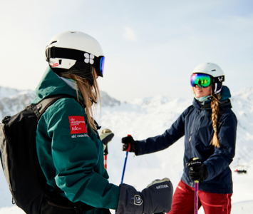 TDC Ski instructor talking with client