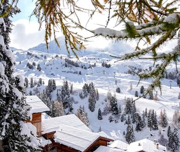chalets in la plagne covered in snow