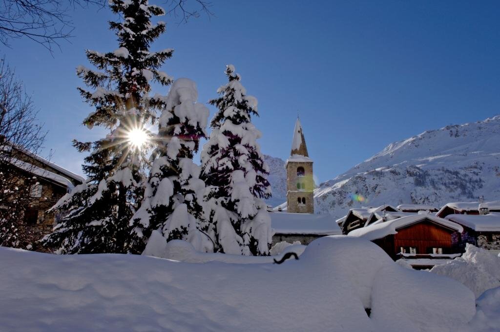 Snowy scene in Val d'Isere with church in the background