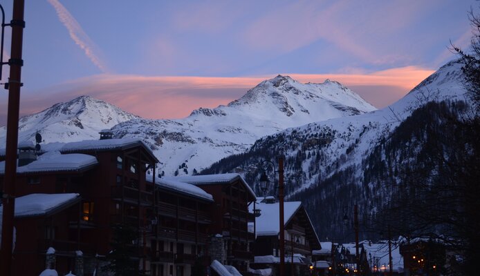 sunset over snow covered mountains in val d'isere 