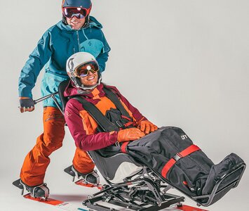 two people doing taxi-skiing 