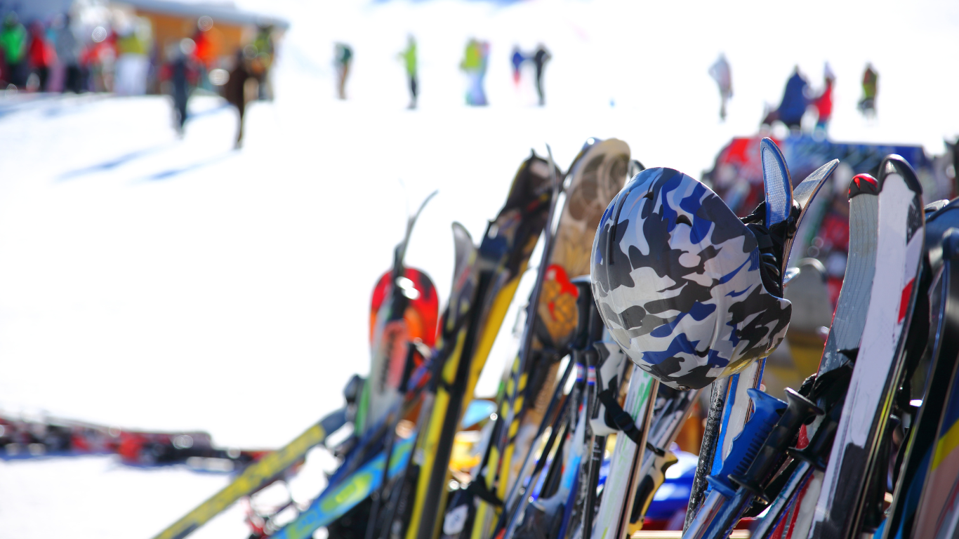 Skis and helmets lined up outside mountain restaurant