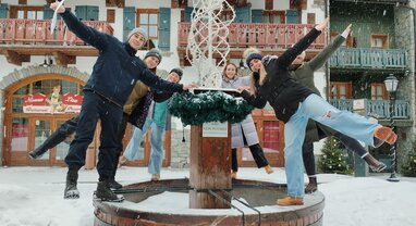 Les Arcs team smiling in the snow