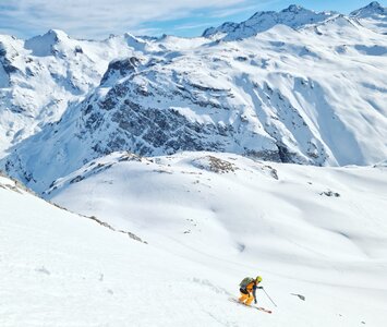 Skier skiing down Tour du Charvet in Val d'Isere