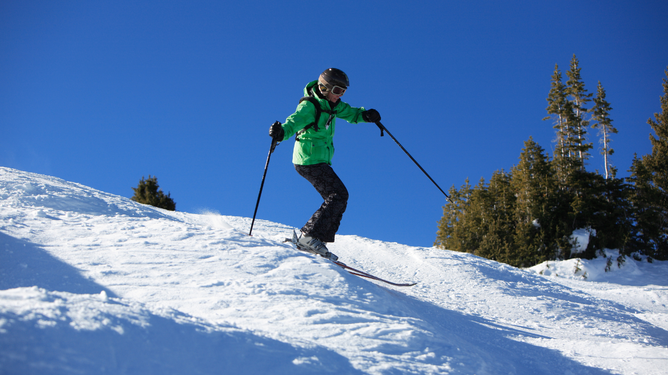 Woman skiing moguls