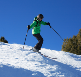 Woman skiing moguls