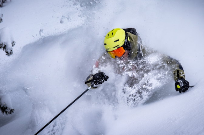 TDC Ski instructor skiing deep powder