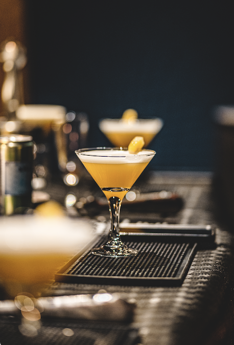 Yellow cocktail in a martini glass