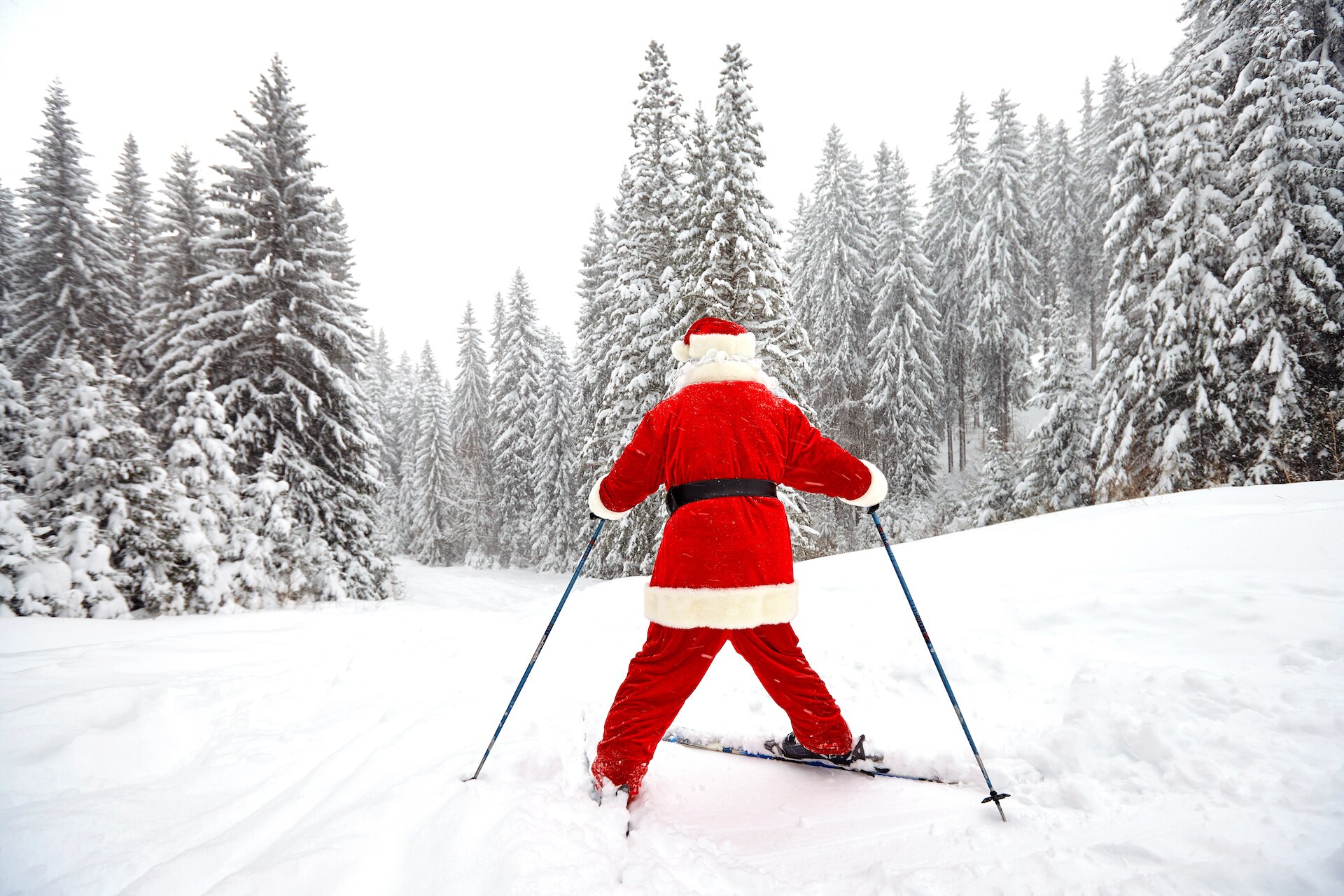 Santa skiing in the Alps at Christmas