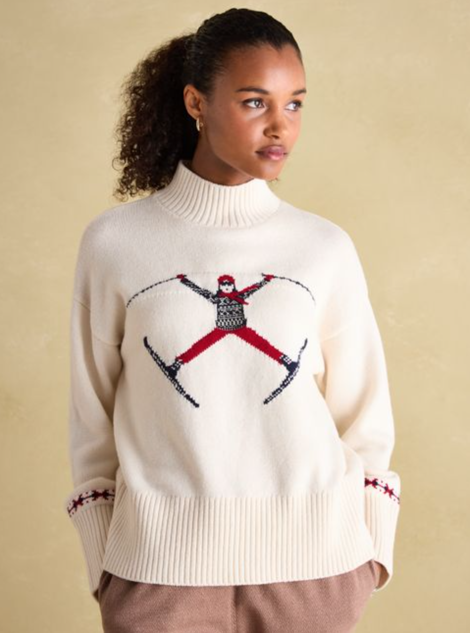 Cream jumper with red and black skier