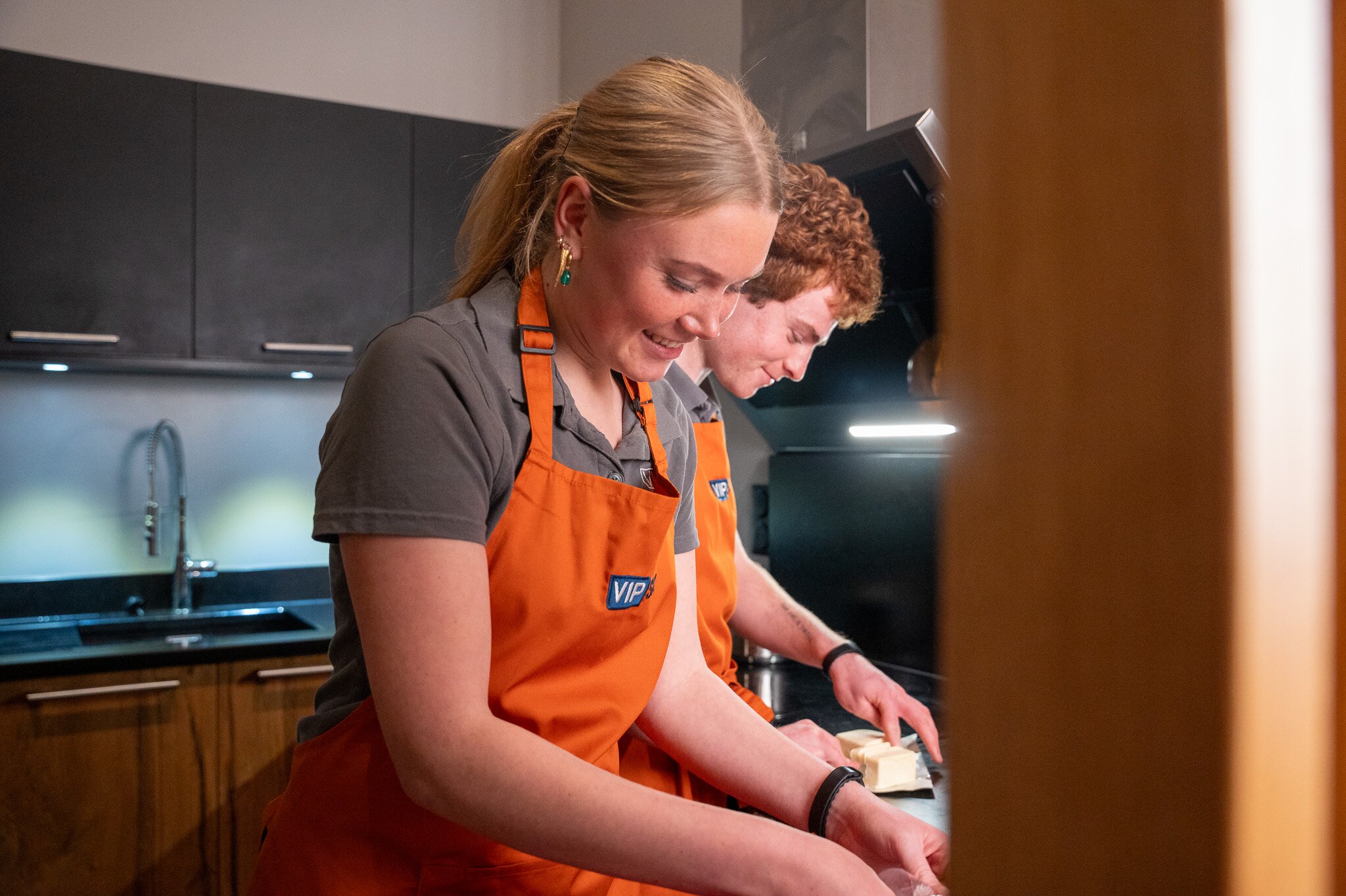 ski chalet hosts in kitchen