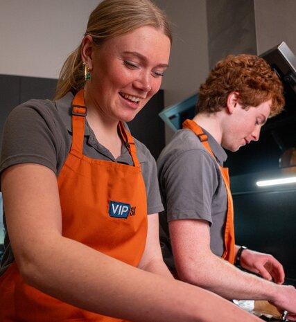 vip ski chalet hosts preparing food