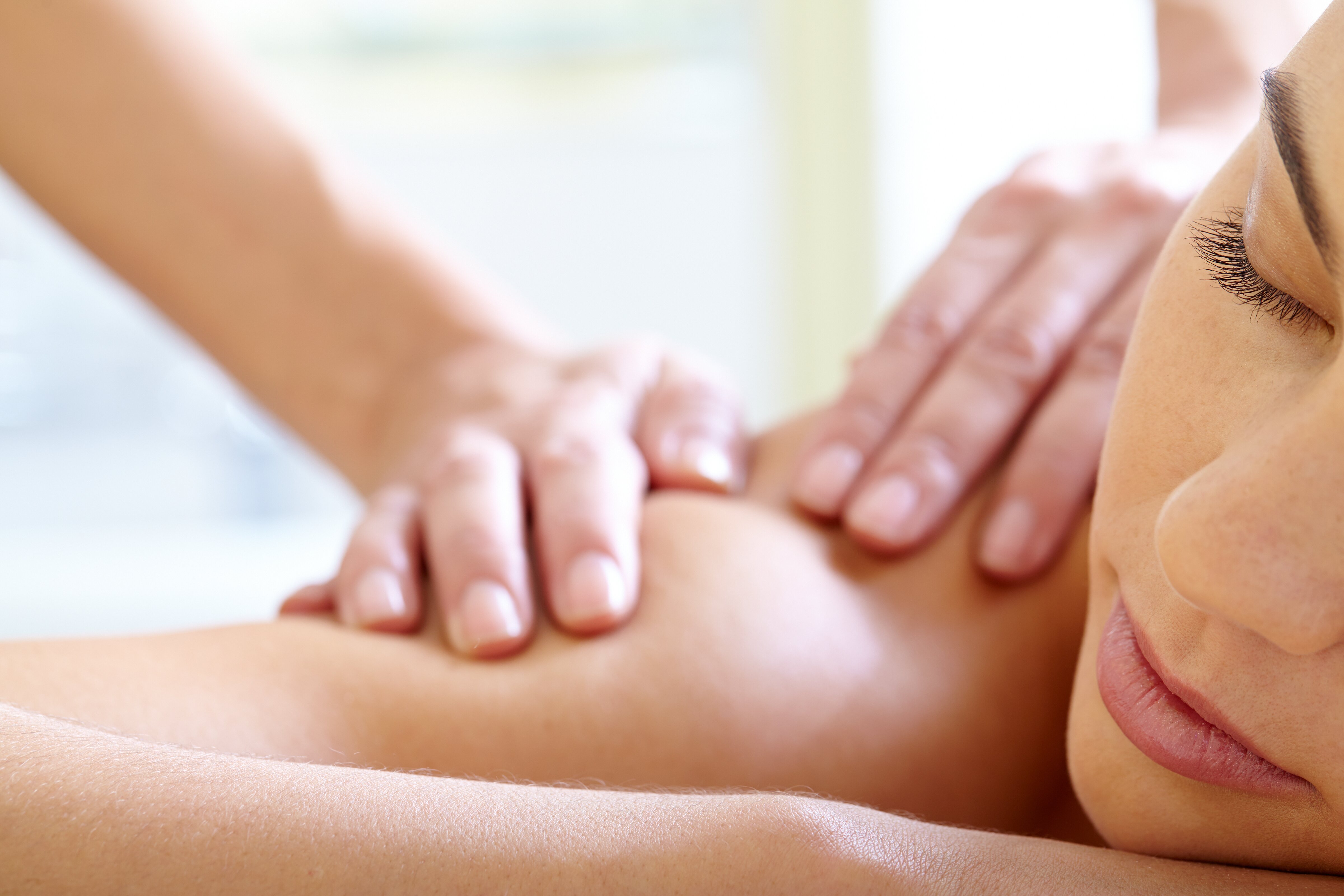 Woman with eyes closed enjoying massage
