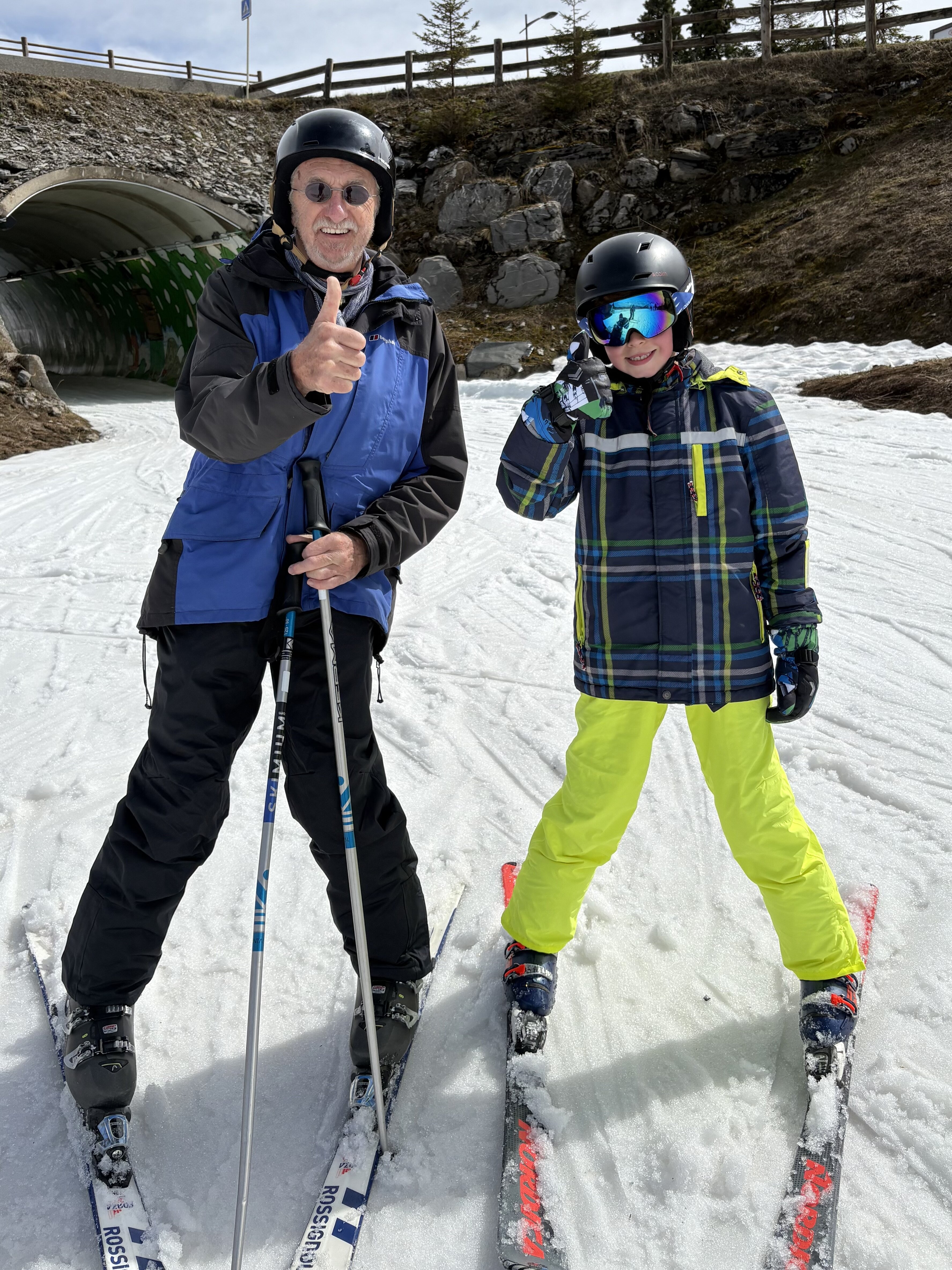Grandpa and grandson skiing
