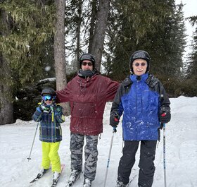 Three generations skiing