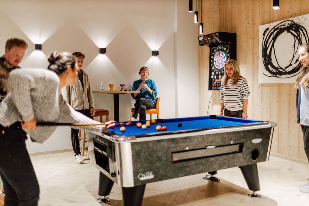 Friends playing pool