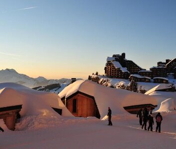 sunset in Avoriaz snow covered chalets 