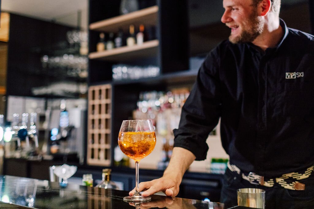 Barman at Bear Lodge serving cocktail