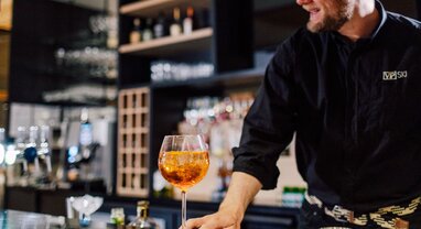 Barman at Bear Lodge serving cocktail