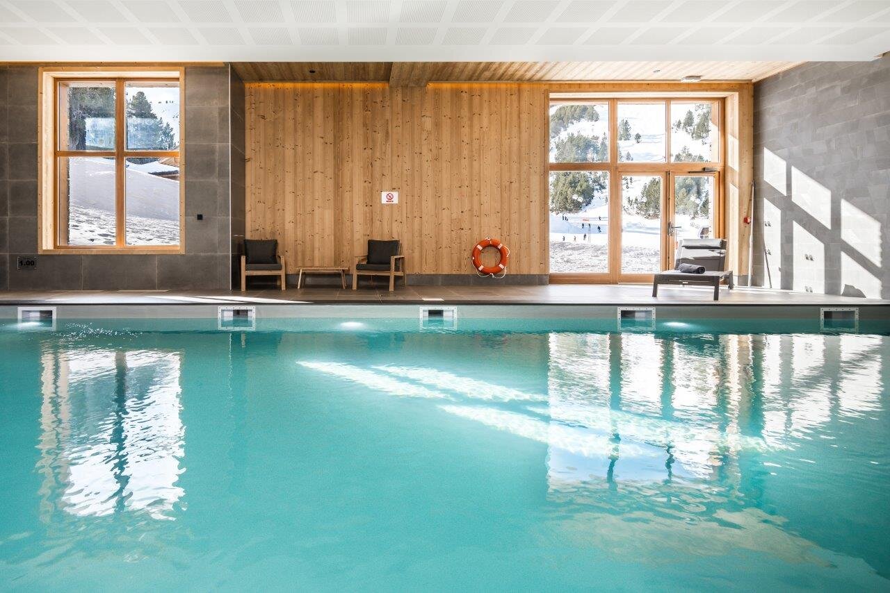 Hotel swimming pool with views of the ski slopes from the windows