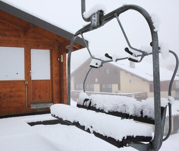 snowy chairlift in la plagne