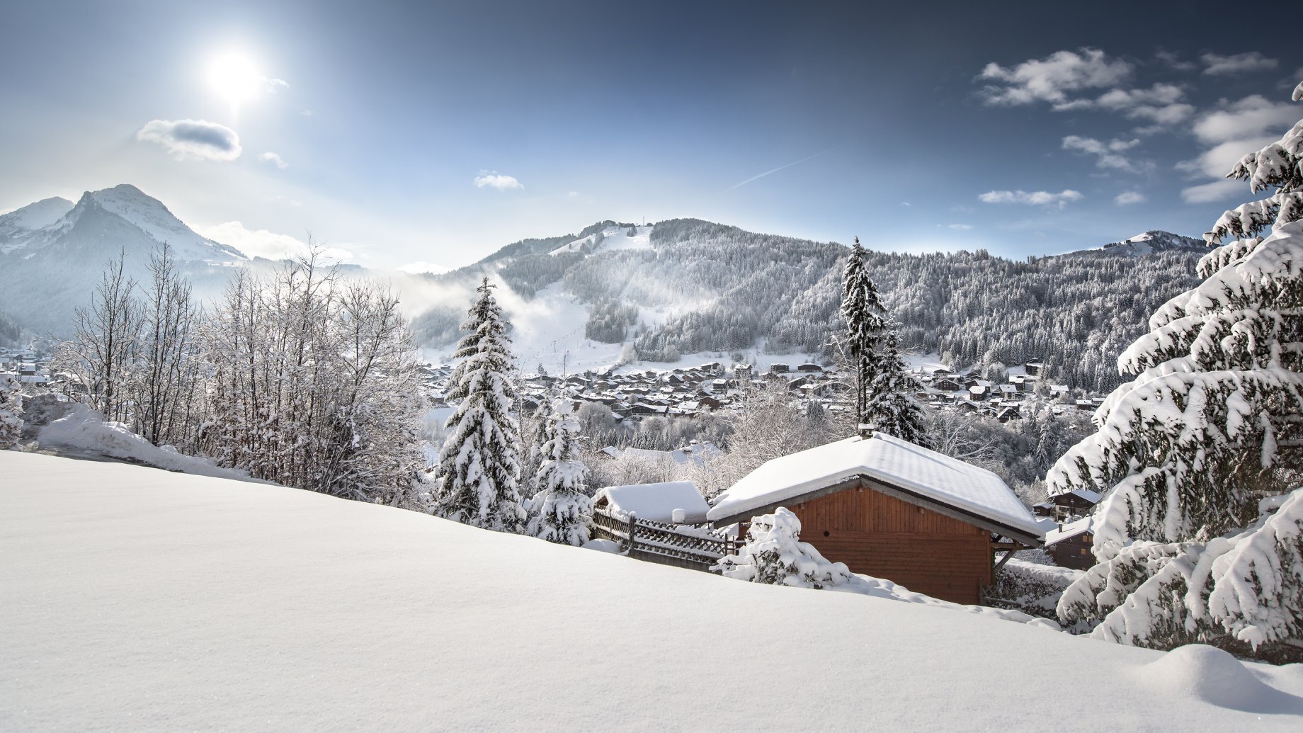 Snowy view from the distance of Morzine in the sunshine