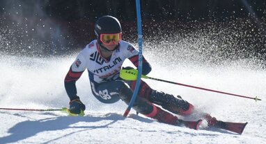 GB skier Max Laughland skiing around slalom pole